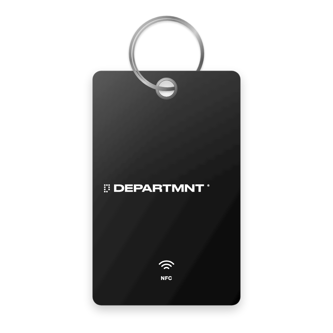 Key tag render: a black card-shaped tag with the DEPARTMNT wordmark, on a steel keyring
